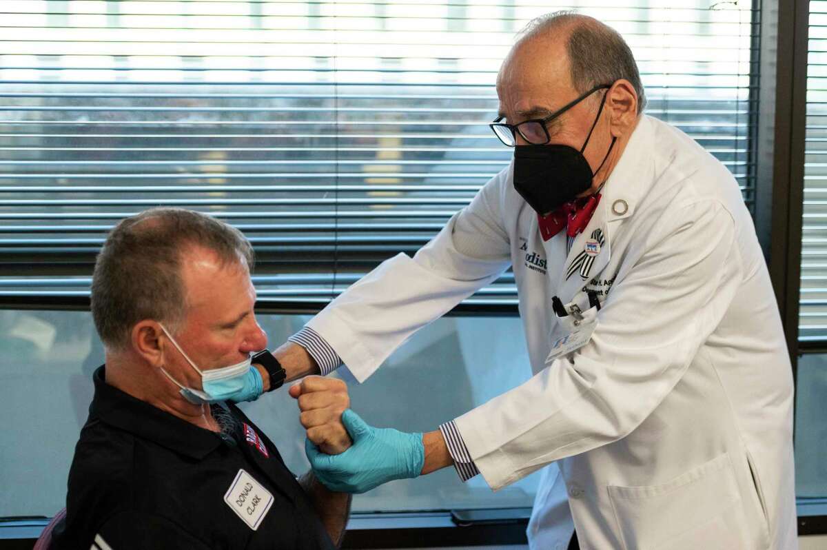 Dr. Stanley Appel examines the muscle strength of Donald Clark in the Stanley H. Appel Department of Neurology in the Houston Methodist Neurological Institute Friday, June 3, 2022, in Houston.