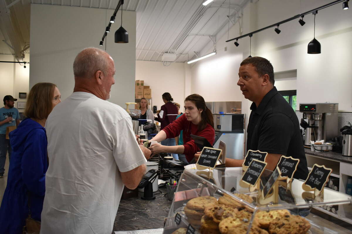 Ebels General Store held a soft opening for the new coffee shop and clothing store, an expansion of the existing Ebels General Store in Reed City. Above, Rich Bennett helps take an order.