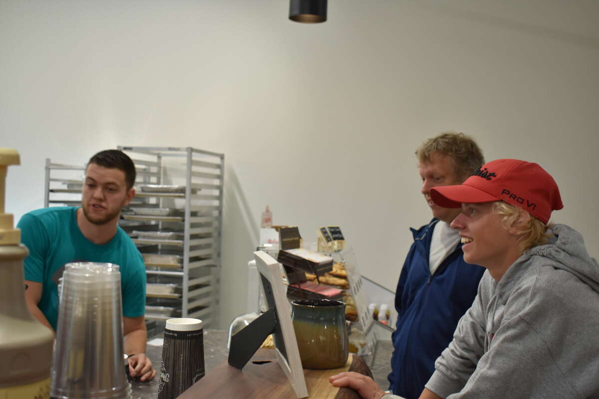 Ebels General Store held a soft opening for the new coffee shop and clothing store, an expansion of the existing Ebels General Store in Reed City. Above, Chase DeMott takes an order.