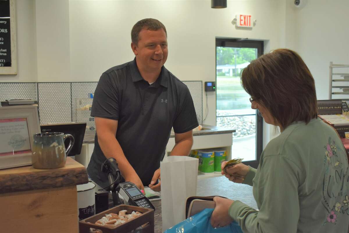 Ebels General Store held a soft opening for the new coffee shop and clothing store, an expansion of the existing Ebels General Store in Reed City. Above, Rich Bennett takes a customer's order.