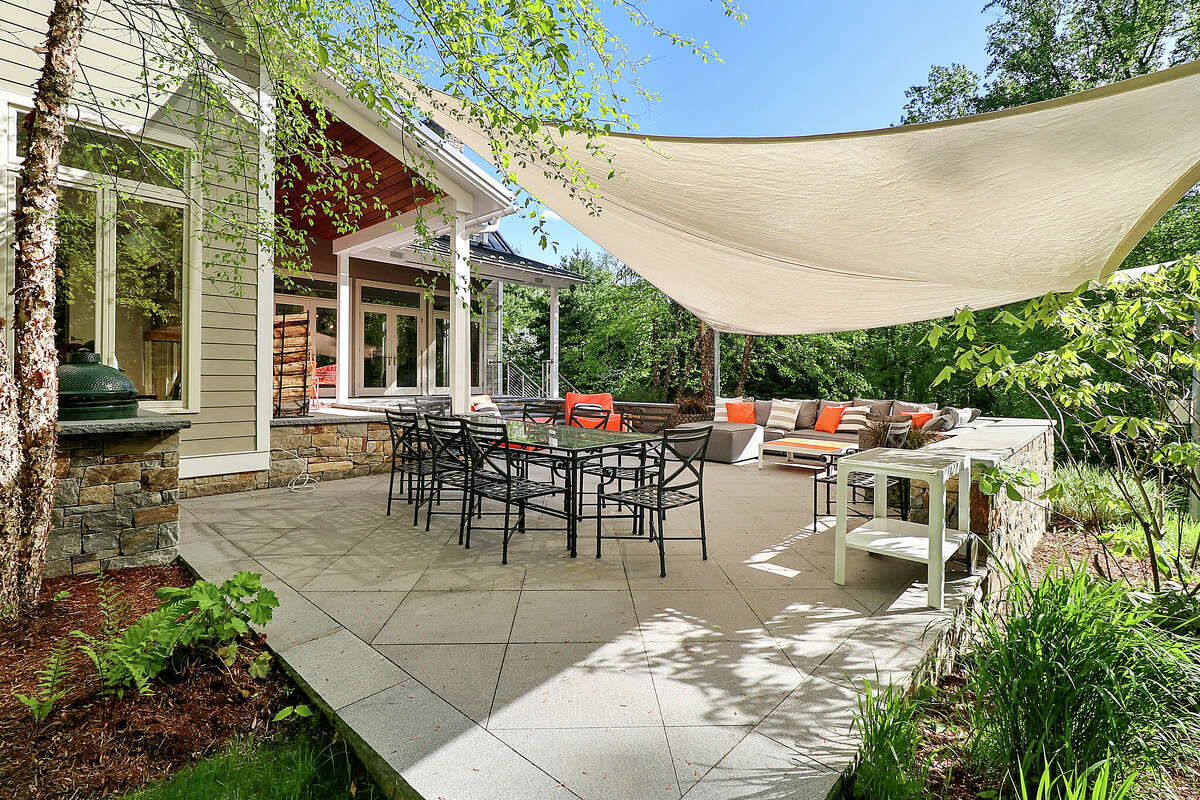The outdoor patio and movie theater area at the home on 392 Brushy Ridge Road in New Canaan, Conn. 
