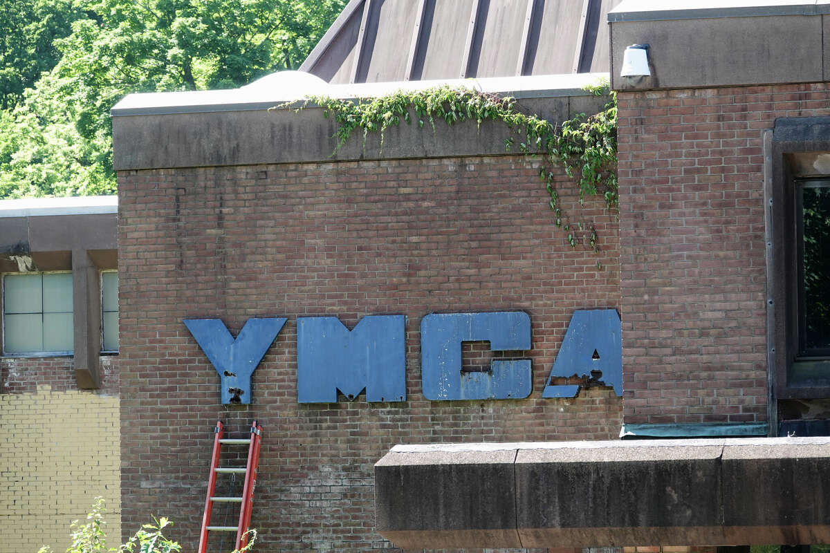 Community stakeholders met Monday at the site of the abandoned YMCA building to celebrate the commencement of its demolition. $25 million will be spent for a new youth building.