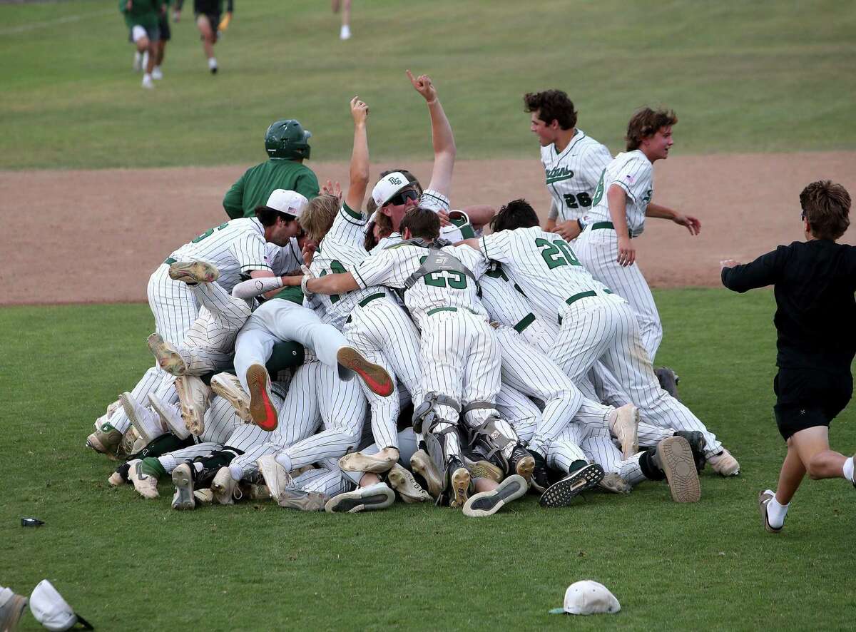 De La Salle-Concord players pile on each other after winning the inaugural NorCal Division I title. The Spartans scored four runs in the bottom of the seventh to beat St. Francis, 7-6.