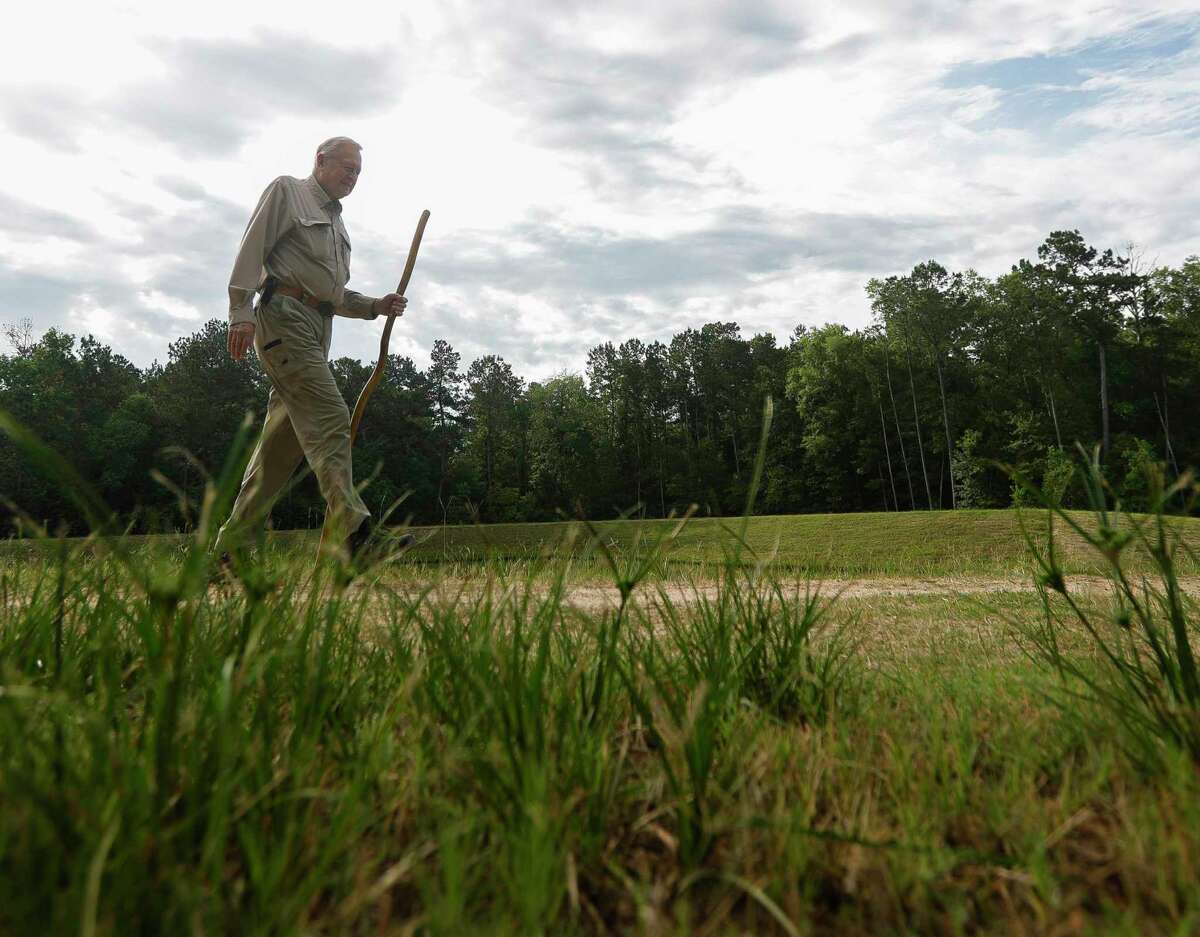 Glenn Buckley, president of the Lake Creek Green Way Partnership, walks through the Lake Creek Preserve Park near the Woodforest community, Thursday, June 2, 2022, in Montgomery. The 64-acre preserve is just south of the Woodforest Development and Golf Course and part of a nature preserve that spans 530 acres. The partnership has built 1.5 miles of nature trail and is working with Magnolia ISD and Lone Star College - Montgomery on education programing.