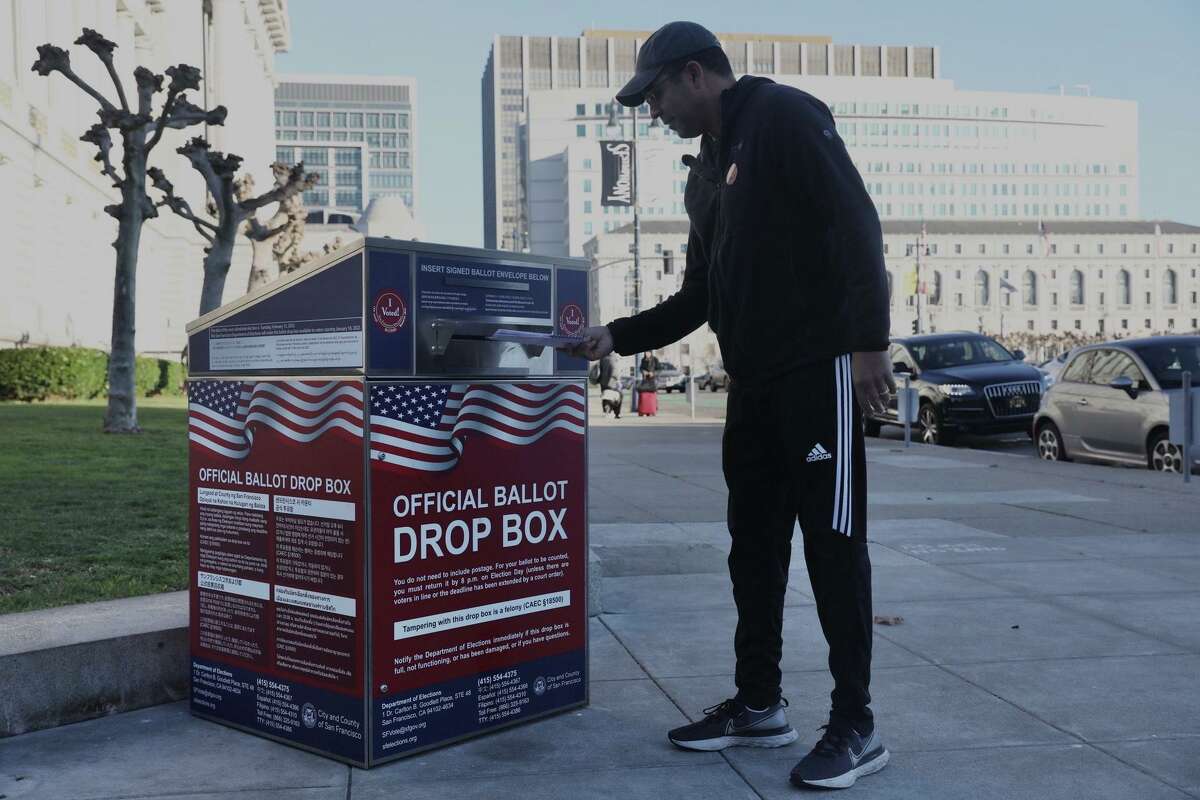 Residents cast their votes in the special election at a ballot box outside of San Francisco City Hall in San Francisco, Calif. Tuesday, February 15, 2022.
