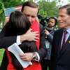 WASHINGTON, DC - MAY 26: Sen. Chris Murphy (D-CT) embraces Erica Leslie Lafferty, whose mother was killed at Sandy Hook Elementary in 2012, as Sen. Richard Blumenthal (D-CT) looks on during a rally with gun control advocacy groups outside the U.S. Capitol on May 26, 2022 in Washington, DC. Organized by Moms Demand Action, Everytown for Gun Safety and Students Demand Action, the rally brought together members of Congress and gun violence survivors to demand gun safety legislation following mass shootings in Buffalo, New York, and Uvalde, Texas. (Photo by Chip Somodevilla/Getty Images)