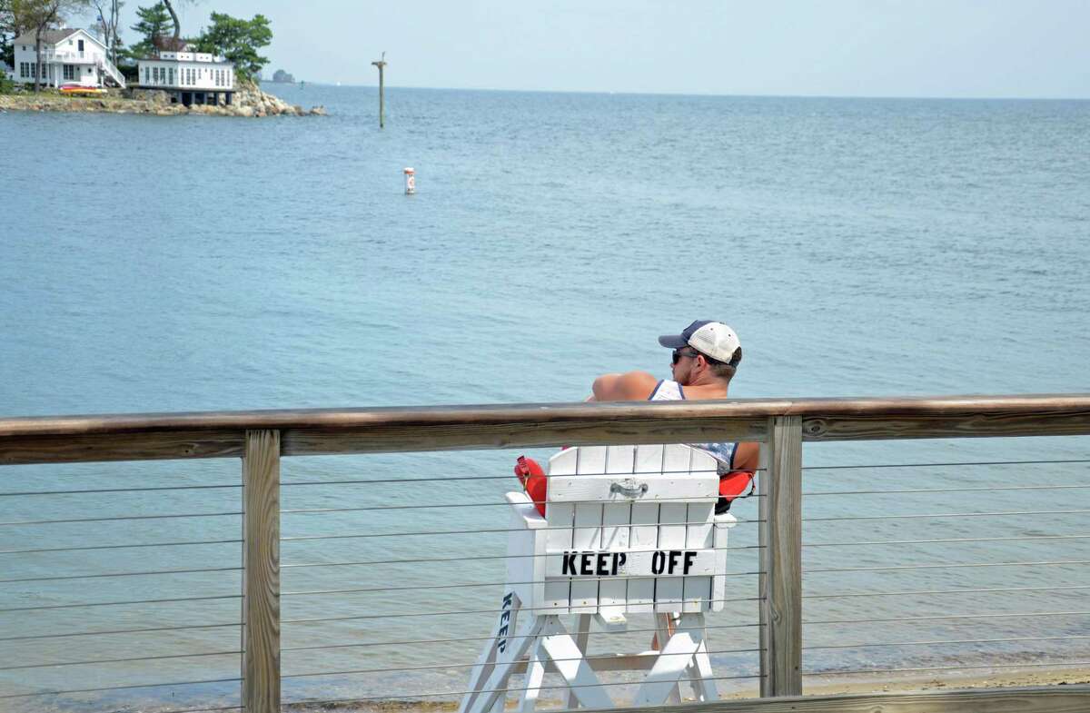 A lifeguard watches over the waterfront at Island Beach on Friday, Aug.21. The town has swimming at two beaches, a pool and two islands but so far there are not as many lifeguards as there have been in the past years.