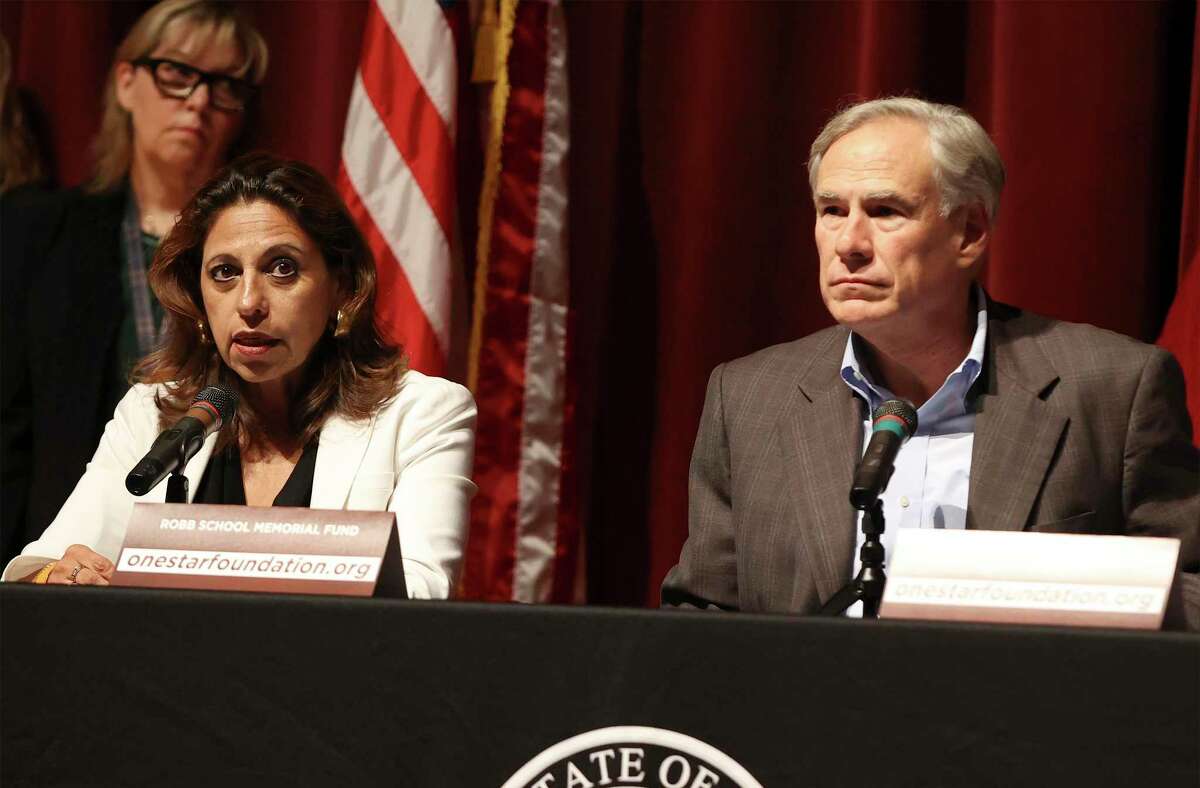Uvalde District Attorney Christina Mitchell Busbee (left) joins Texas Gov. Greg Abbott as he announces a fund to help the families of the Robb Elementary shootings during a press conference in Uvalde on Friday, May 27, 2022. Abbott also expressed outrage after learning the initial details of the shooting was not as accurate as he reported based on information he was provided.