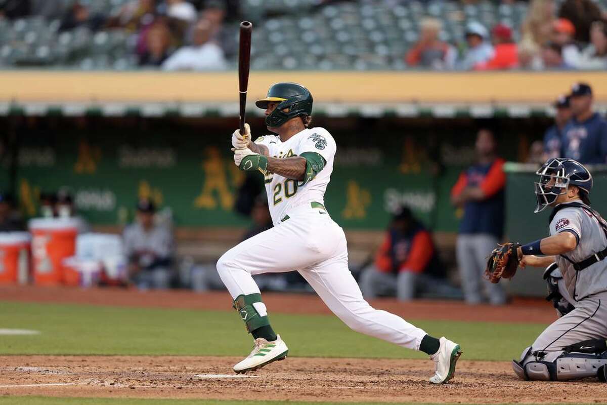 OAKLAND, CALIFORNIA - MAY 31: Cristian Pache #20 of the Oakland Athletics hits a single that scored a run against the Houston Astros in the fourth inning at RingCentral Coliseum on May 31, 2022 in Oakland, California. (Photo by Ezra Shaw/Getty Images)