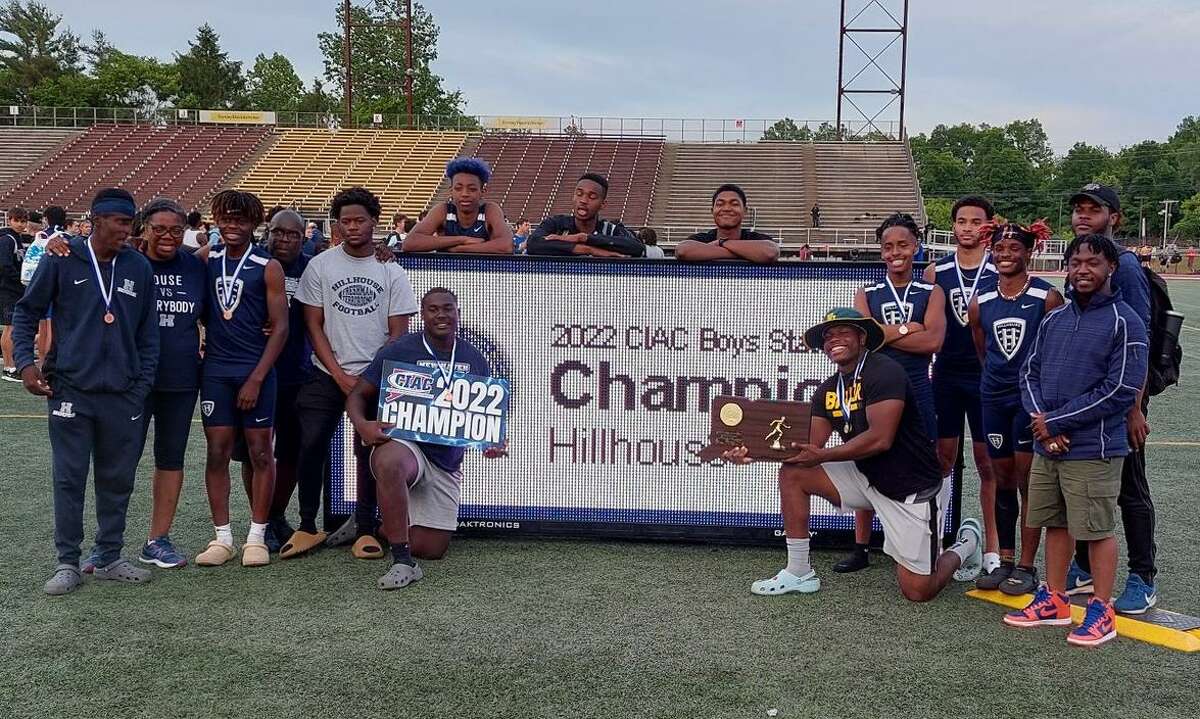 Members of the Hillhouse boys track and field team celebrate after winning the program's second-straight State Open title and third overall Monday in New Britain.