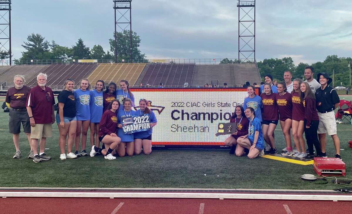 Sheehan’s girls track and field team celebrates after winning the first State Open title in program history Monday in New Britain.