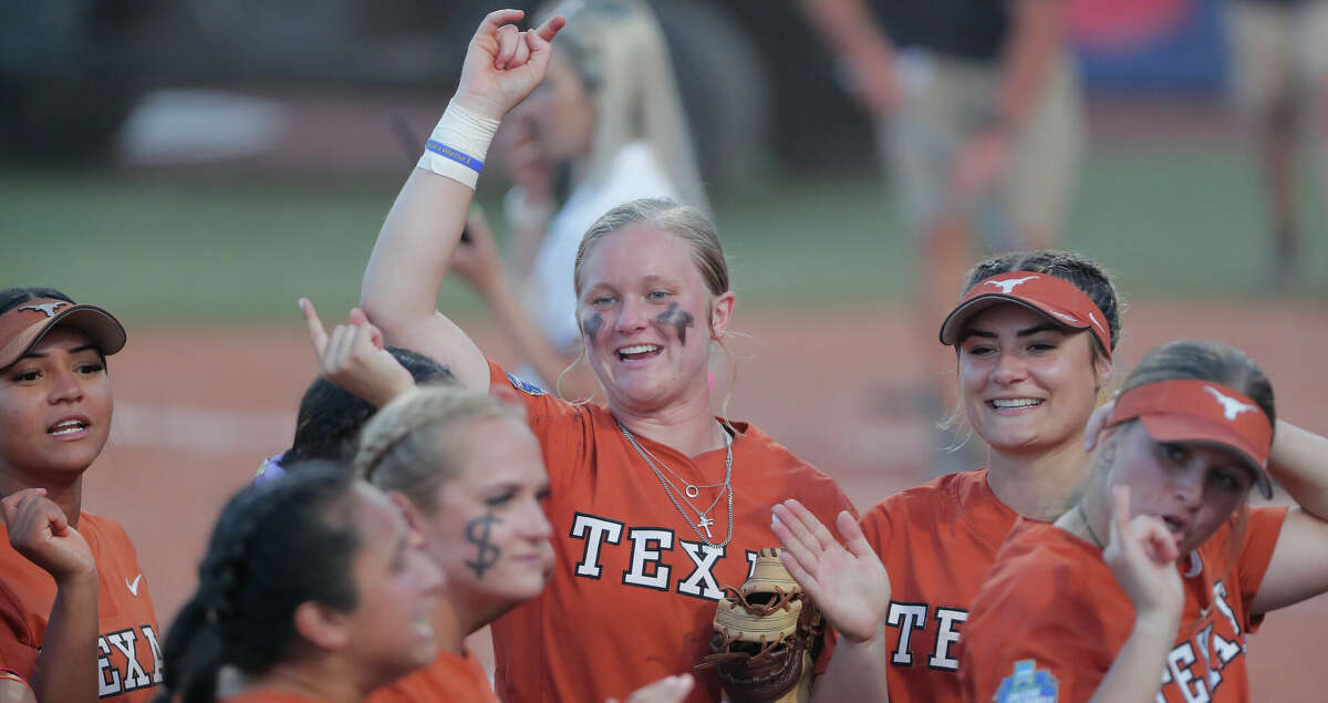 Texas' Alyssa Washington (11) celebrates after her team defeated Oklahoma State in an NCAA softball Women's College World Series game on Monday, June 6, 2022, in Oklahoma City. (AP Photo/Alonzo Adams)