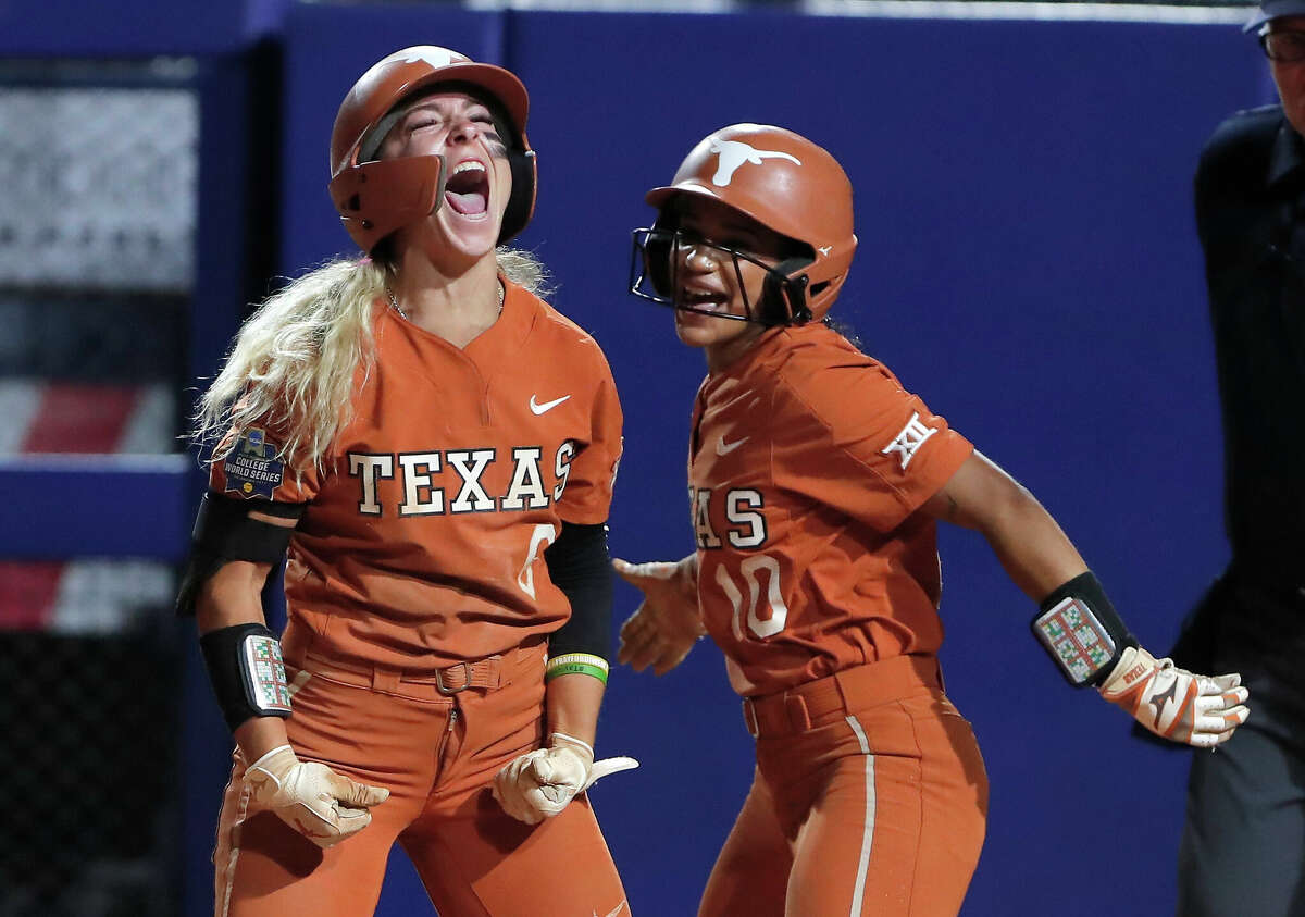Texas' Isabella Dayton (6) and Mia Scott (10) celebrate during a win over Oklahoma State in the College World Series last year. Both will be back for Texas.