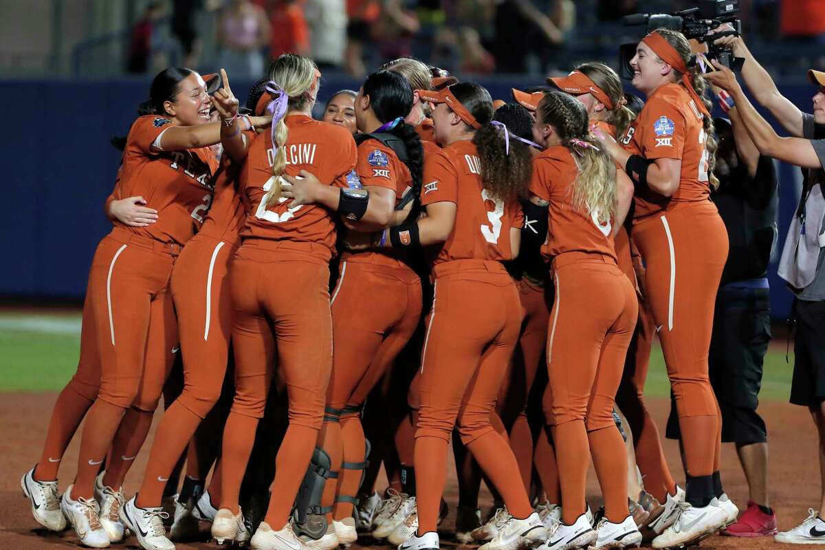 Texas players celebrate after defeating Oklahoma State during an NCAA softball Women's College World Series game on Monday, June 6, 2022, in Oklahoma City. Texas won 6-5. (AP Photo/Alonzo Adams)