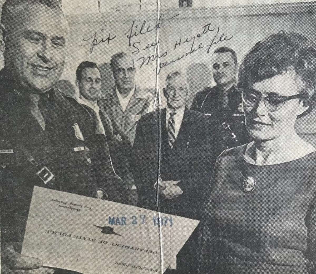 Mrs. Russell Hyatt of South Homer Road, receives a life saving certificate from Sgt. Daniel Kostrzewa, commander of the Mount Pleasant State Police post in recognition for saving the life of Penny Corwin, daughter of State Police Trooper George Corwin from drowning in the Chippewa River. Looking on, from left, are Barryton residents Jerry Wyan, Gerald Sherman and Edward Schade, who are credited with assisting Hyatt, and Trooper Corwin. Hyatt is a nurse at Midland Hospital. March 1971