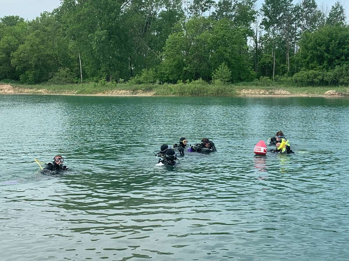 Students practice diving in a gravel pit provided by the Huron County Road Commission.