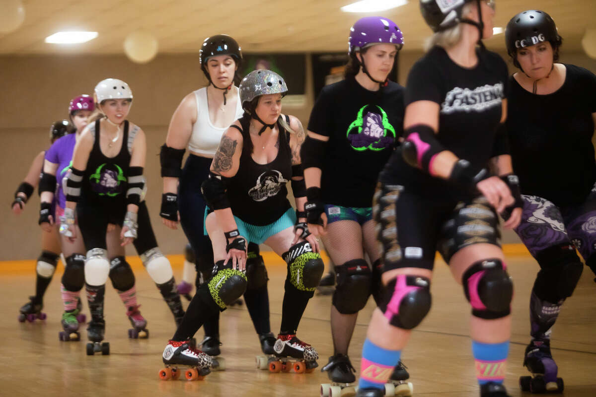 Emily Rewerts of Midland, or "Suzy SeamRIPper," center, skates with teammates as the Chemical City Derby Girls hold practice Monday, June 6, 2022 at the Roll Arena in Midland.