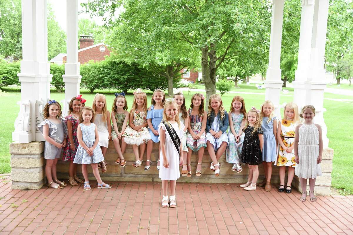 Little Miss Jersey County Olivia Mooney, center, is joined by the junior division contestants for the 2022 Jersey County Queen Pageant. From left are Josie Mae Carpunky, Rosalie Hay, Hattie Mae Kadell, Adalynn Perdun, Jane Abbey, Annabeth Childs, Lola Yoder, Ryleigh Guthrie, Parker Turner, Tessa Huelskoetter, Nora Hagen, Lucille Lilley, Carly Ringhausen, Diem Hurt and Margaret Newell.