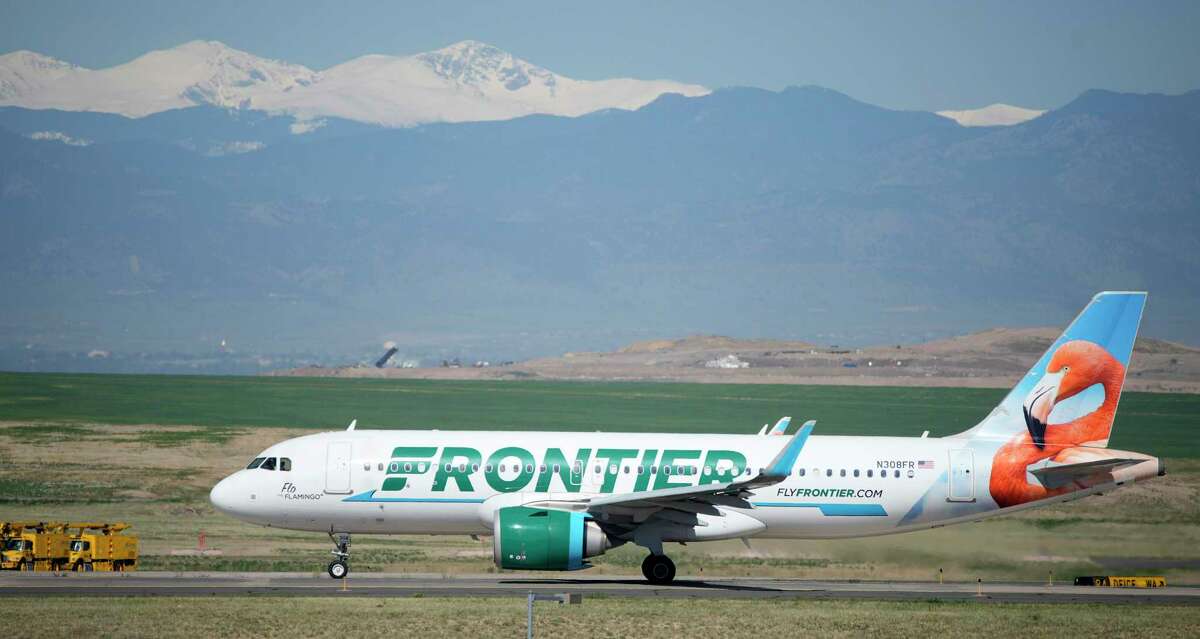 A Frontier Airlines jetliner taxis to a runway for take off from Denver International Airport Thursday, May 26, 2022, in Denver. Experts are expecting record crowds at airports and on the nation's byways during the long Memorial Day weekend, which marks the start of the summer travel season, in spite of high fuel costs. (AP Photo/David Zalubowski)
