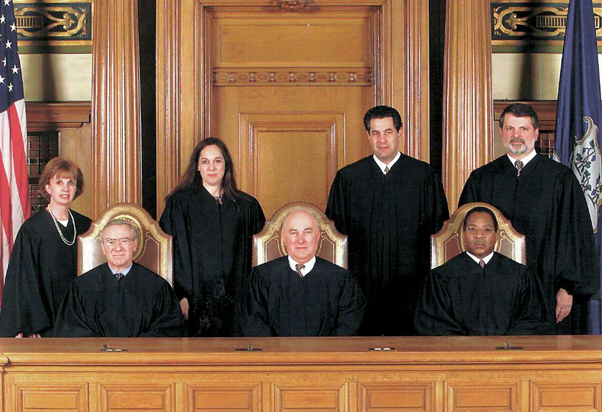 The State Supreme Court in an undated photo. Seated from left, Justice David M. Borden, Chief Justice William J. Sullivan, Justice Flemming L. Norcott, Jr. Standing left to right: Justice Christine S. Vertefeuille, Justice Joette Katz, Justice Richard N. Palmer, Justice Peter T. Zarella. Sullivan, who served as the 36th Chief Justice of the state Supreme Court, died at the age of 83, according to officials Tuesday.