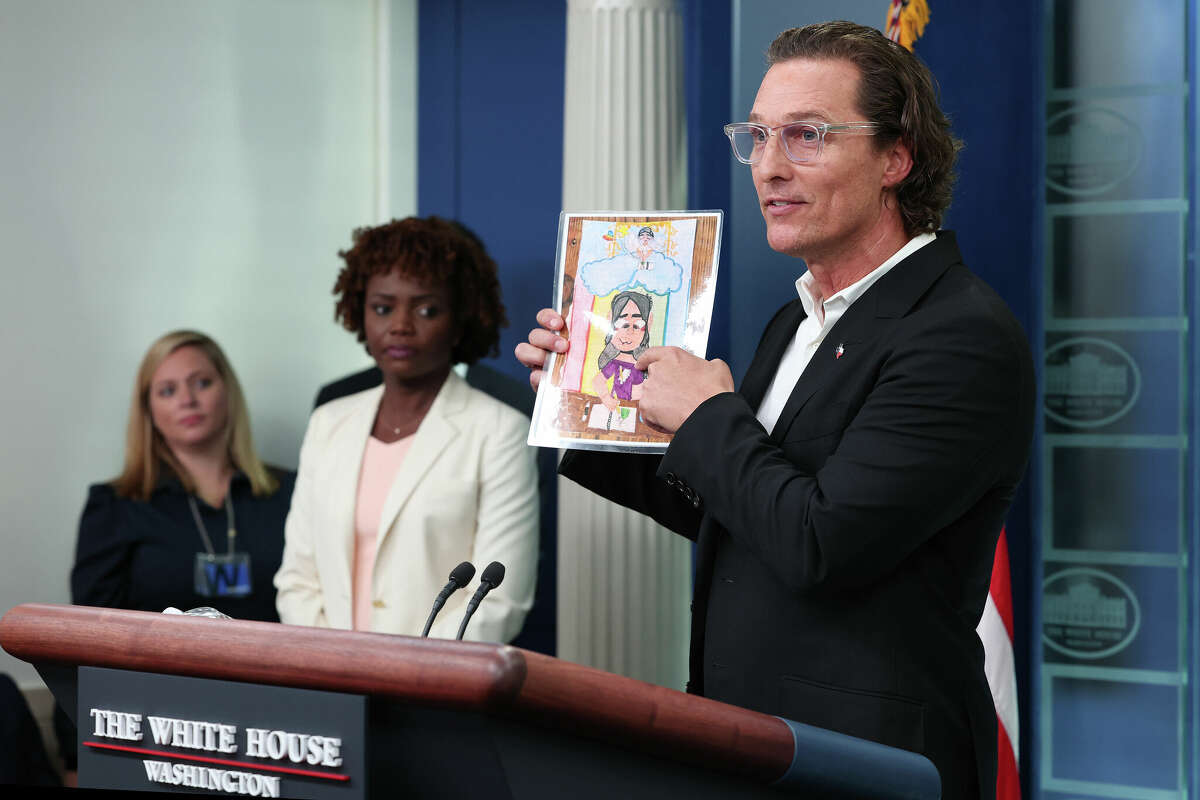 WASHINGTON, DC - JUNE 07: After meeting with President Joe Biden, Actor Matthew McConaughey holds up artwork by one of the victims of the school shooting in Uvalde, Texas, during the daily news conference in the Brady Press Briefing Room at the White House on June 07, 2022 in Washington, DC. McConaughey, a native of Uvalde, expressed his support for new legislation for more gun control in the wake of the elementary school shooting in his home town that left 19 children and 2 adults dead. (Photo by Win McNamee/Getty Images)