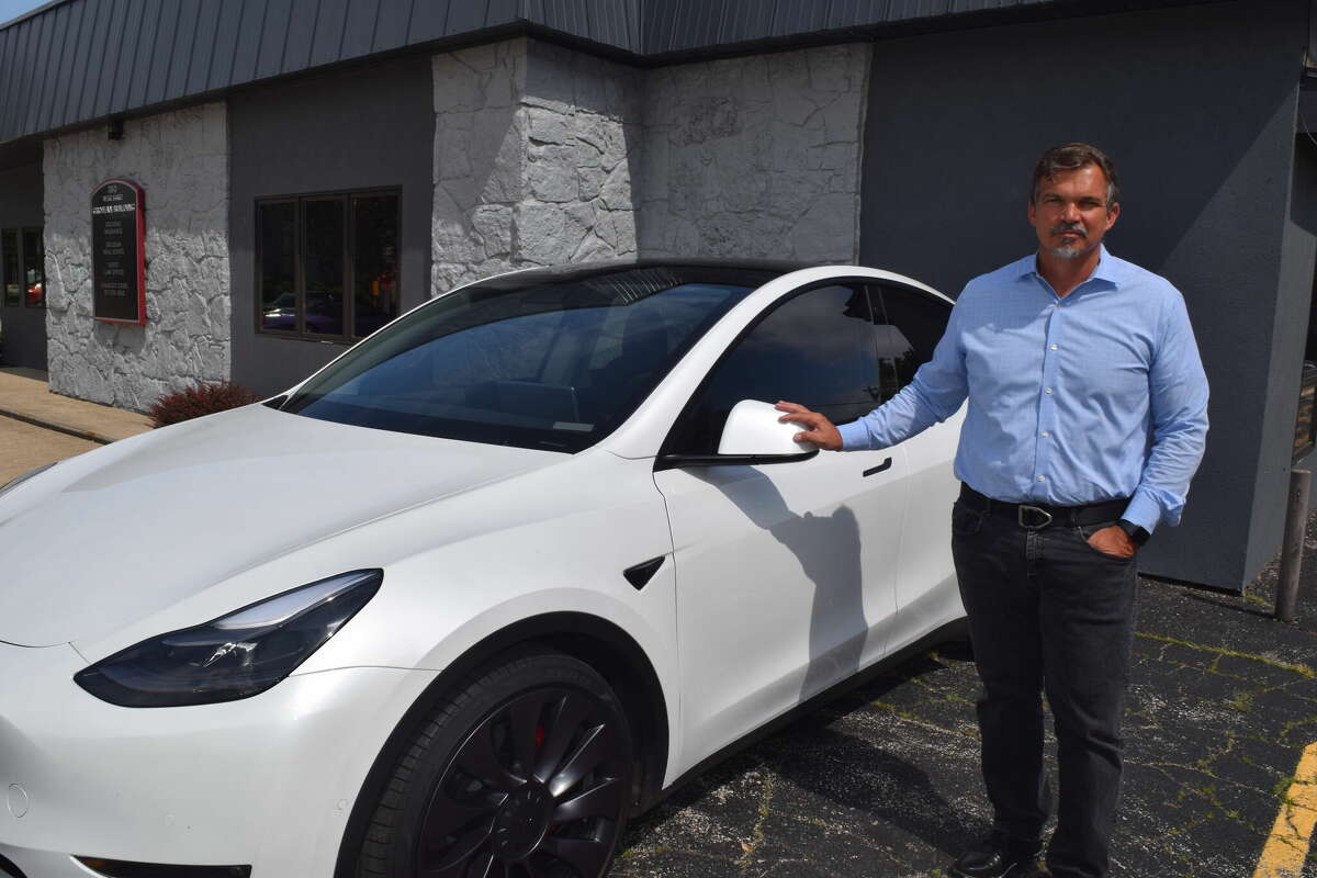 Adam Grojean of Jacksonville has owned a Tesla for more than a year. 