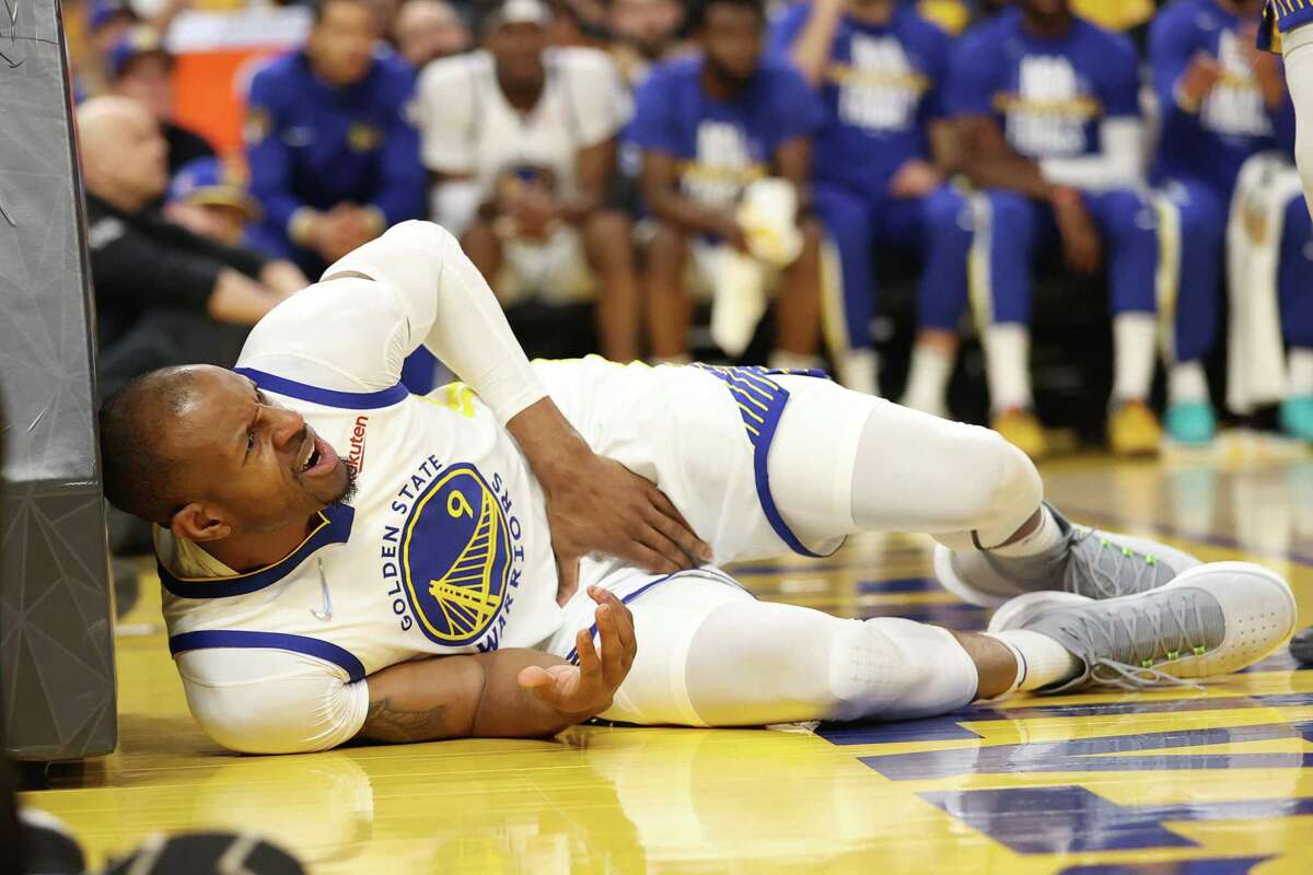 Golden State Warriors’ Andre Iguodala reacts to getting accidentally kneed in the groin by Boston Celtics’ Jayson Tatum during Game 1 of NBA Finals at Chase Center in San Francisco, Calif., on Thursday, June 2, 2022.