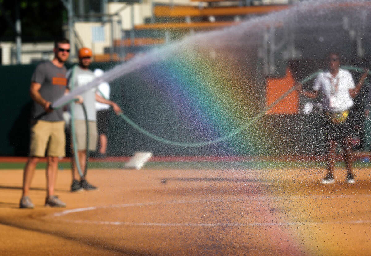 A rainbow is seen as the field is prepared before a Class 6A semifinal game between Deer Park and Lake Ridge during the UIL State Softball Championships at Red & Charline McCombs Field, Friday, June 3, 2022, Austin.