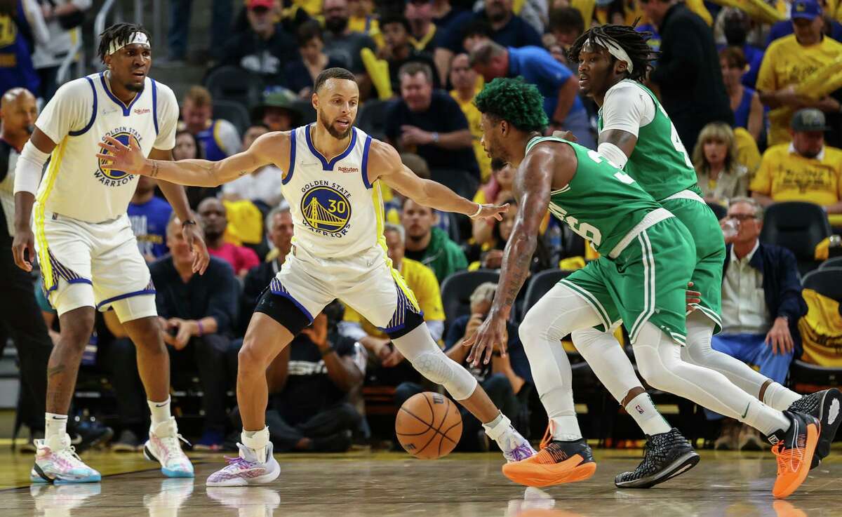 Golden State Warriors' Stephen Curry, 30, guards Boston Celtics' Marcus Smart, 36, during the third quarter of the NBA Finals at Chase Center in San Francisco, Calif., on Thursday, June 2, 2022.