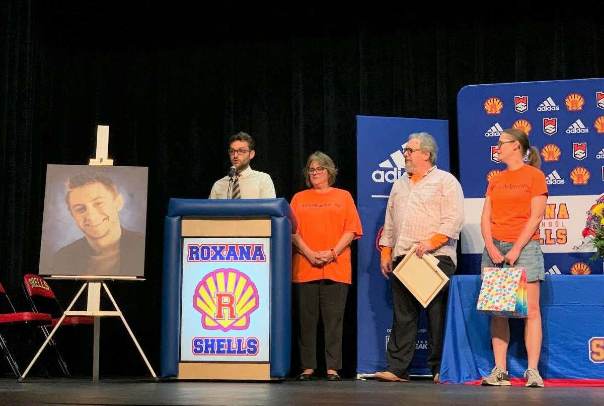 The Bacus family, left to right, Oliver Bacus and his parents, Debbie and Mark Bacus, and Noel Schiber present the Shine Like Spencer Kindness award, named after the late Spencer  Bacus, a 2012 Roxana High School graduate who died in 2018 from a rare cancer.  This was the fourth $500 scholarship awarded annually and established by the Bacuses.  
