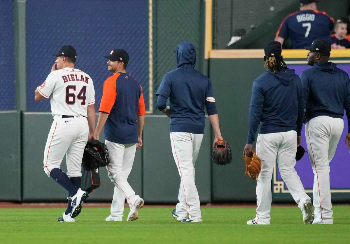 Houston Astros pitcher Brandon Bielak and other relievers walk out to the bullpen before the start of the first inning of a MLB game at Minute Maid Park on Tuesday, June 7, 2022 in Houston.