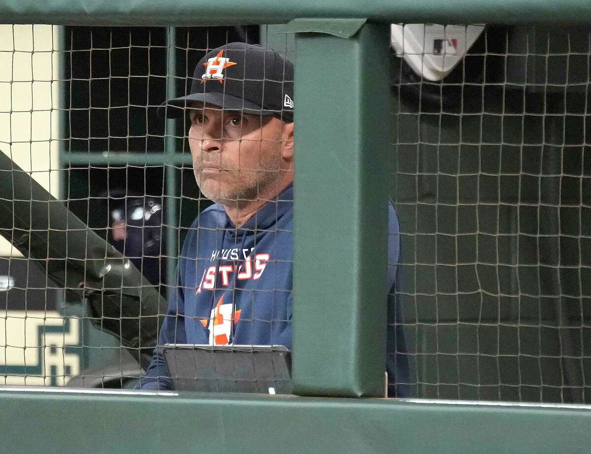 Houston Astros bench coach Joe Espada (19) in the dugout while he was acting manager, as manager Dusty Baker Jr. served a one-game suspension during the first inning of a MLB game at Minute Maid Park on Tuesday, June 7, 2022 in Houston.