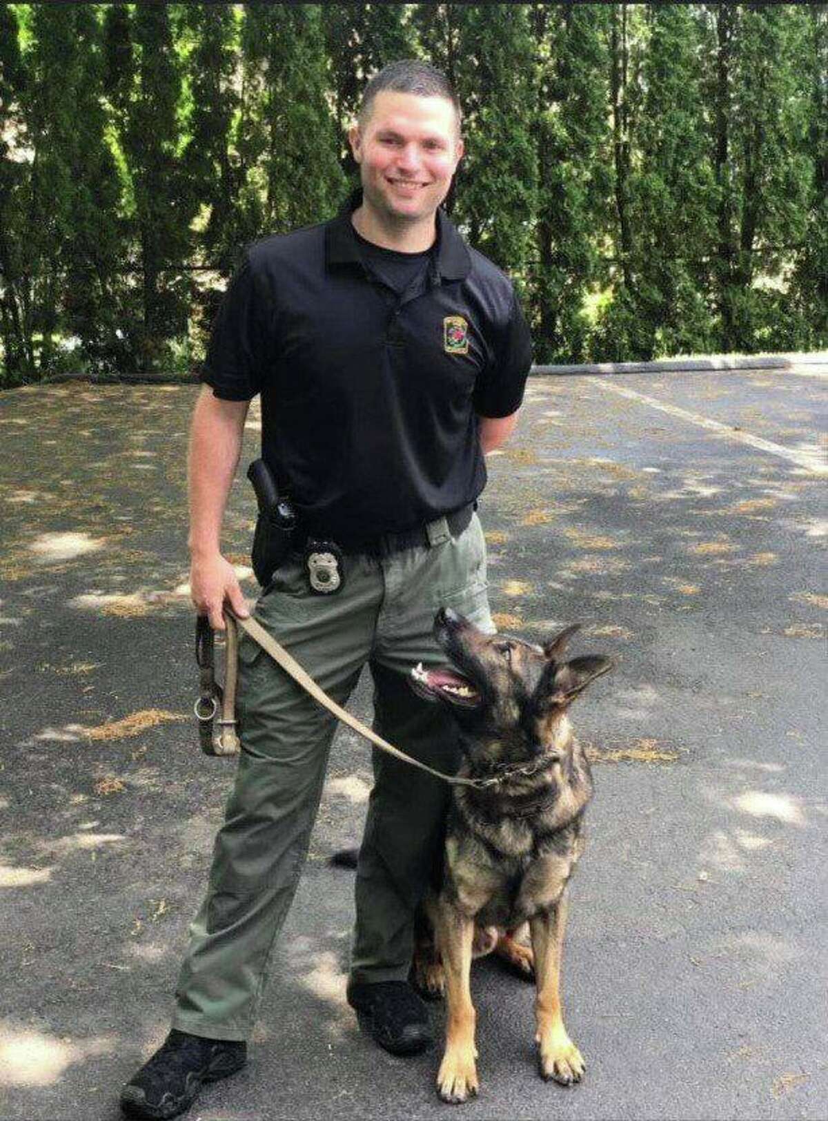 Officer First Class Ken Wright and K-9 Officer Ozzy. Ozzy suffered a medical emergency and died Saturday, according to the Norwich Police Department.