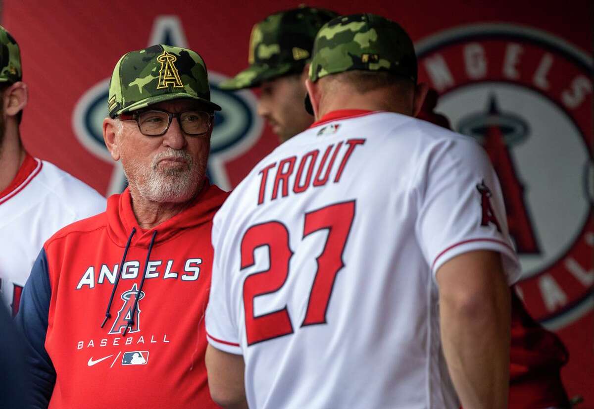 Angels manager Joe Maddon talks with Mike Trout before a game against the A’s in Anaheim on May 20. The Angels are in a 3-16 skid overall since May 15, when they were 24-13.