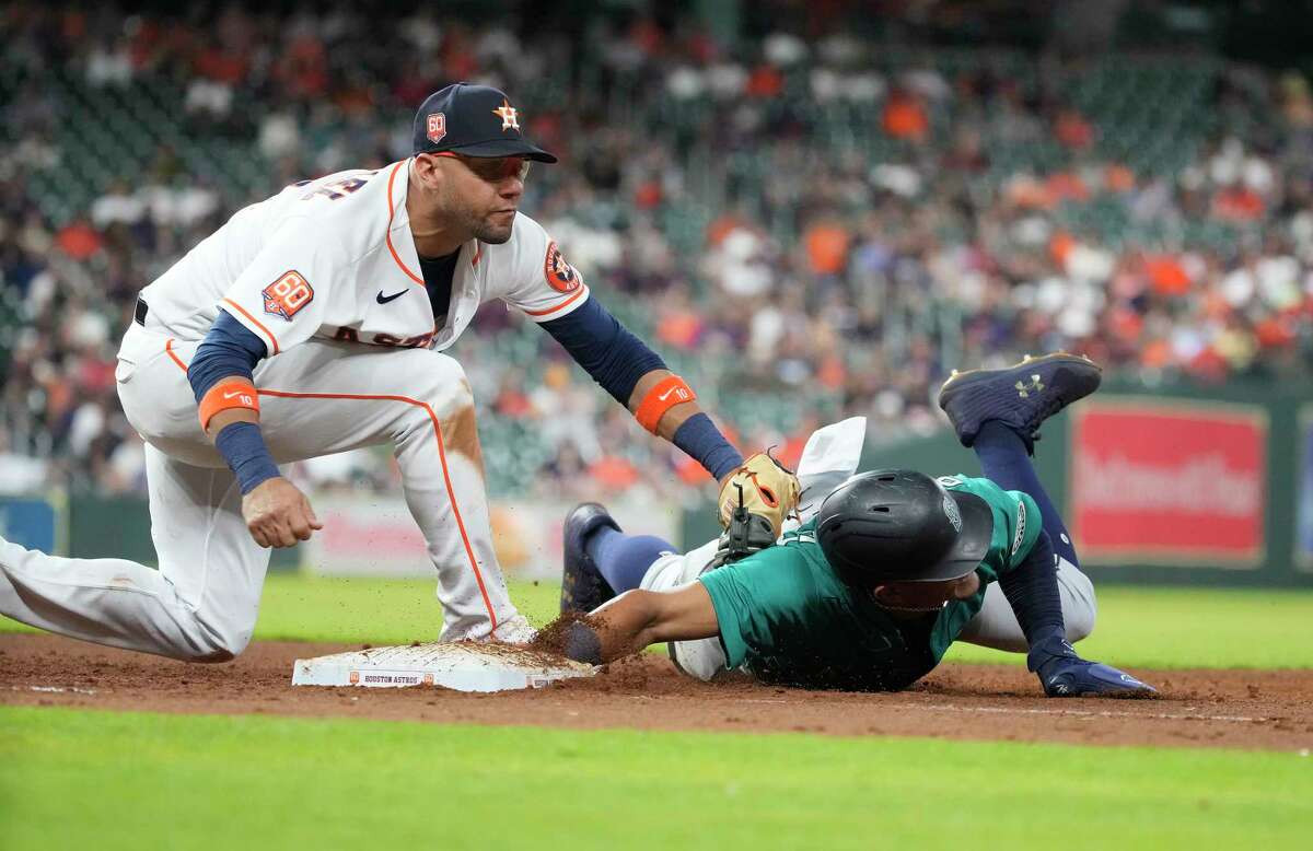 First baseman Yuli Gurriel, left, and the Astros will play seven of their next 12 games against American League Rookie of the Year front-runner Julio Rodriguez and the Mariners, who have won 14 in a row as the season's second half begins.
