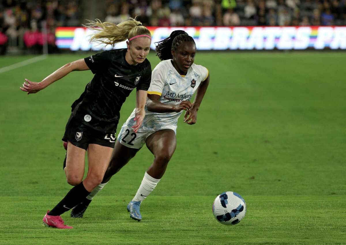LOS ANGELES, CALIFORNIA - JUNE 07: Tyler Lussi #17 of Angel City FC chases after the ball past Michelle Alozie #22 of the Houston Dash during the second half in a 0-0 draw at Banc of California Stadium on June 07, 2022 in Los Angeles, California.