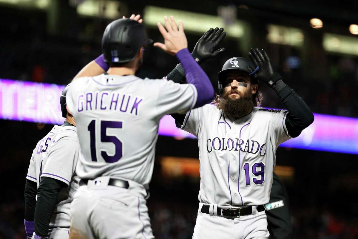SAN FRANCISCO, CALIFORNIA - JUNE 07: Charlie Blackmon #19 of the Colorado Rockies is congratulated by Randal Grichuk #15 after he hit a pinch-hit three-run home run int he sixth inning against the San Francisco Giants at Oracle Park on June 07, 2022 in San Francisco, California. (Photo by Ezra Shaw/Getty Images)