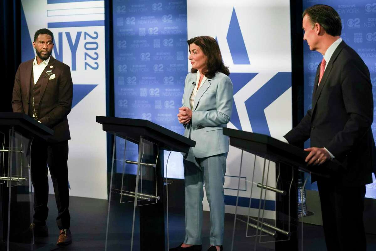 New York Public Advocate Jumaane Williams, left, New York Governor Kathy Hochul, center, Congressman Tom Suozzi, D-N.Y., prepare to face off during New York's governor primary debate at the studios of WCBS2-TV, Tuesday, June 7, 2022, in New York. (AP Photo/Bebeto Matthews)