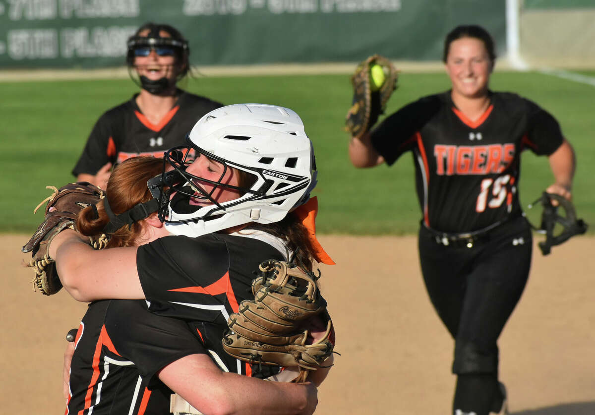 Edwardsville's Lexie Griffin hugs Brooke Tolle after the final out of the Class 4A Illinois Wesleyan Super-Sectional at Inspiration Field on Tuesday in Bloomington.