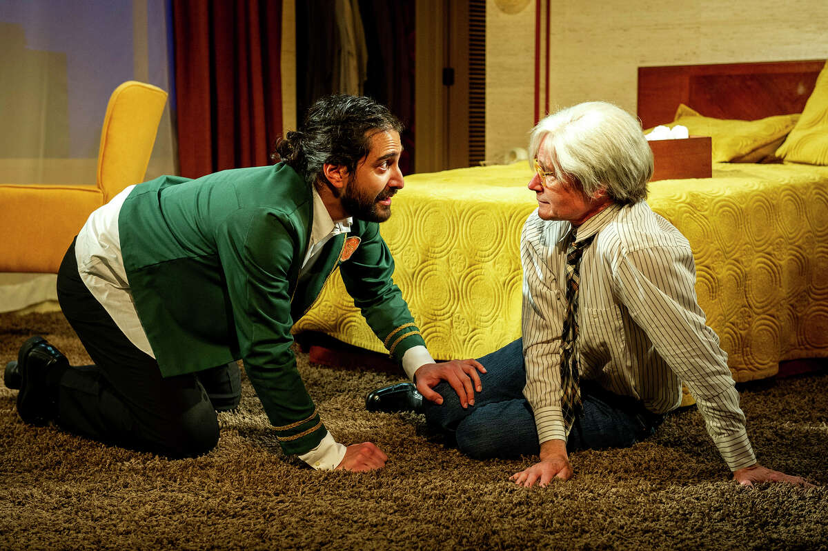  Nima Rakhshanifar, left, plays as a young Iranian radical opposite Henry Stram as the American artist Andy Warhol in the world premiere of "Andy Warhol in Iran," commissioned by Barrington Stage Company from playwright Brent Askari and running in Pittsfield, Mass., from June 2 to 25, 2022.