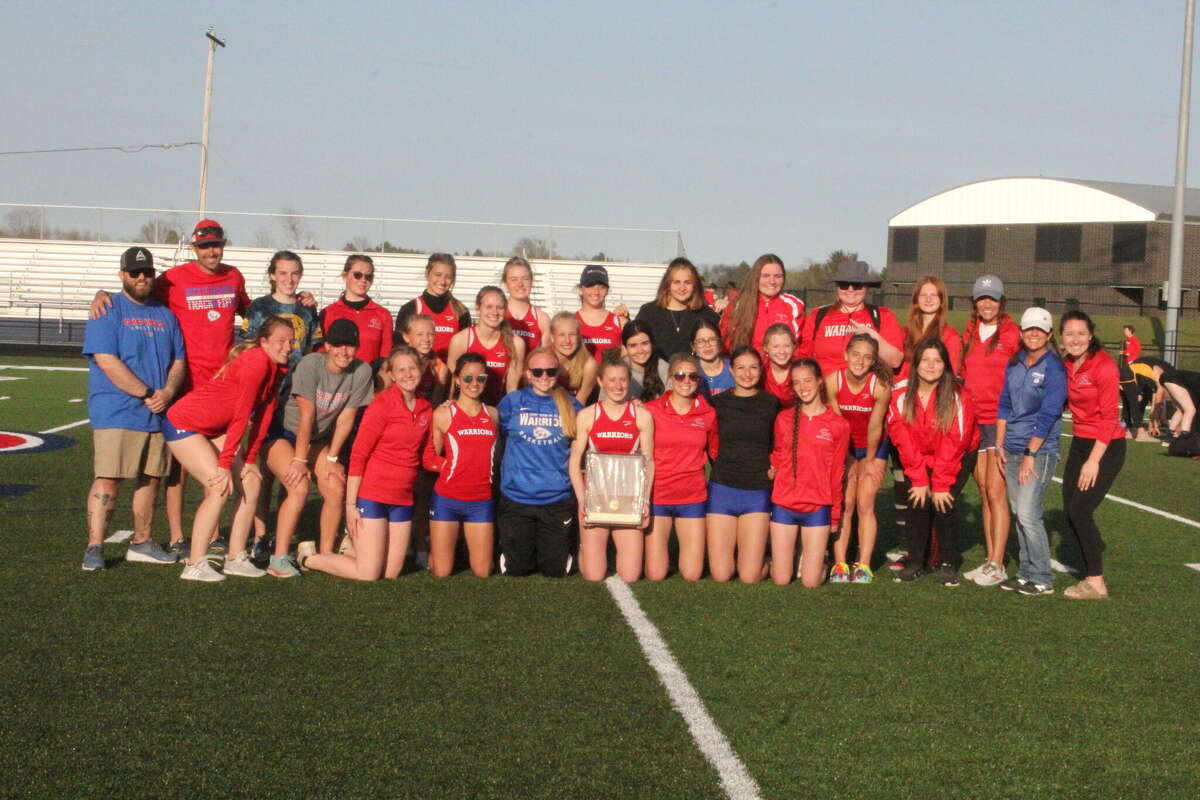 Chippewa Hills, for the 19th straight season, posed for league girls track and field title pictures.