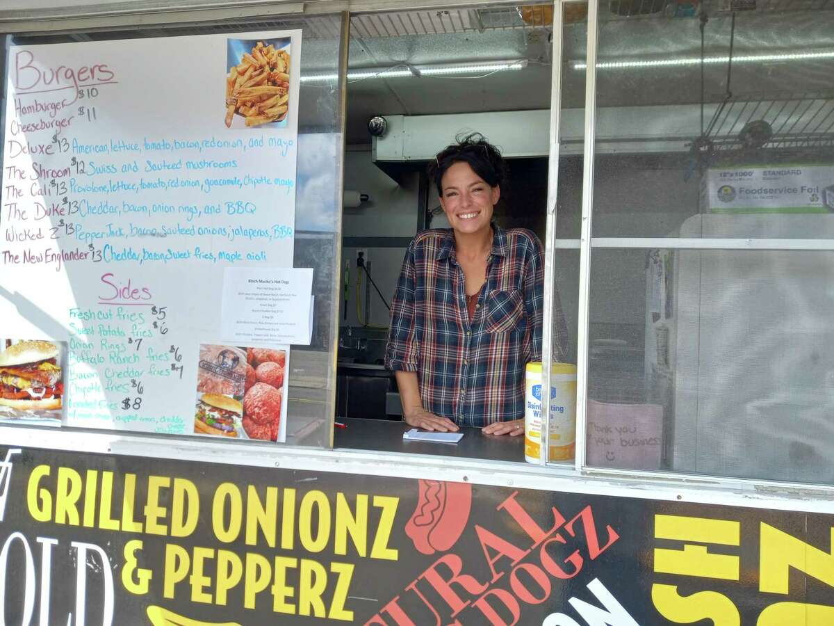 Talia Zabbara, owner of Hot Z’s, a food truck she operates on Water Street, Torrington, sells burgers, hot dogs and specialty sandwiches, and is very busy on sunny weekdays.