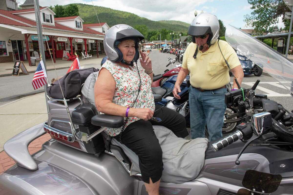 Bill Opp, 80, and his wife Barbara, 77, who have been coming to Americade since it started, mount their 3-wheel motorbike during the annual event on Wednesday, June 8, 2022 in Lake George, N.Y.