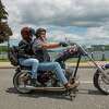 Bikers make their way down a street during the annual Americade on Wednesday, June 8, 2022 in Lake George, N.Y.