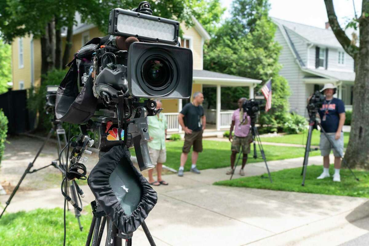 Television crews film near the home of Supreme Court Justice Brett Kavanaugh, in Chevy Chase, Md., Wednesday, June 8, 2022. Officials say an armed man who threatened to kill Justice Brett Kavanaugh was arrested near the justice’s house in Maryland. A law enforcement official says the California man in his 20s was armed with a gun and a knife.