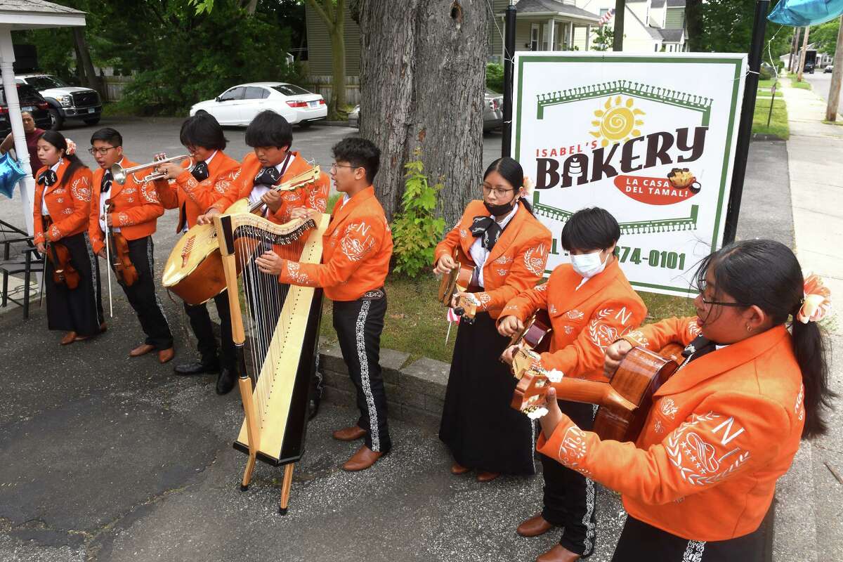 Mariachi Nueva Inspiración plays during a ribbon cutting ceremony at Isabel's Bakery and Restaurant, in the Devon neighborhood of Milford, Conn. June 7, 2022.
