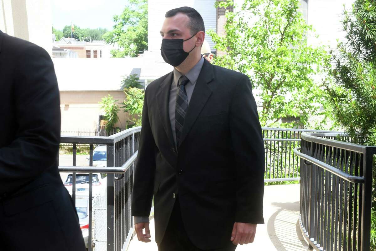 Trumbull Police Sgt. Matthew Perkowski arrives at state Superior Court in Debry, on Wednesday.
