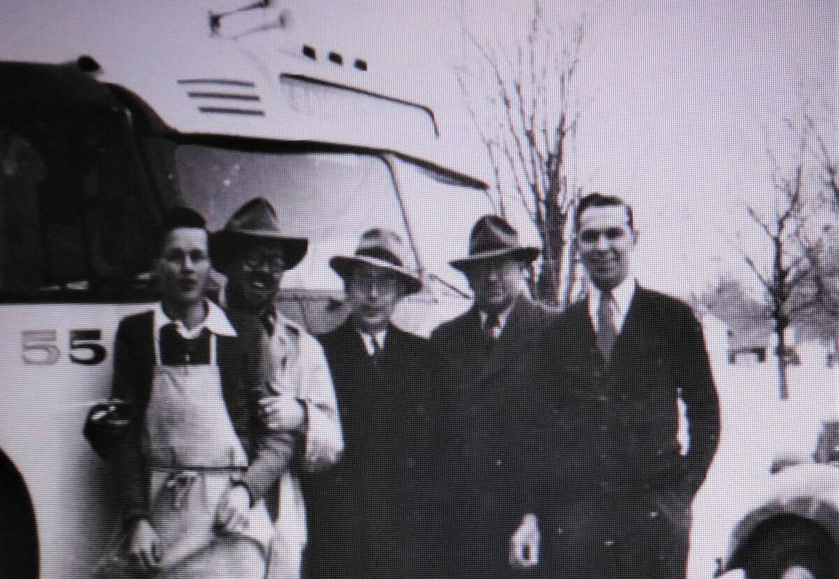 North Star Bus Lines had a stop at Asa Case's Standard Station in Benzonia. This 1947 picture shows the bus with several North Star employees and Grant Forrester, owner of Beulah Drug, on the right.