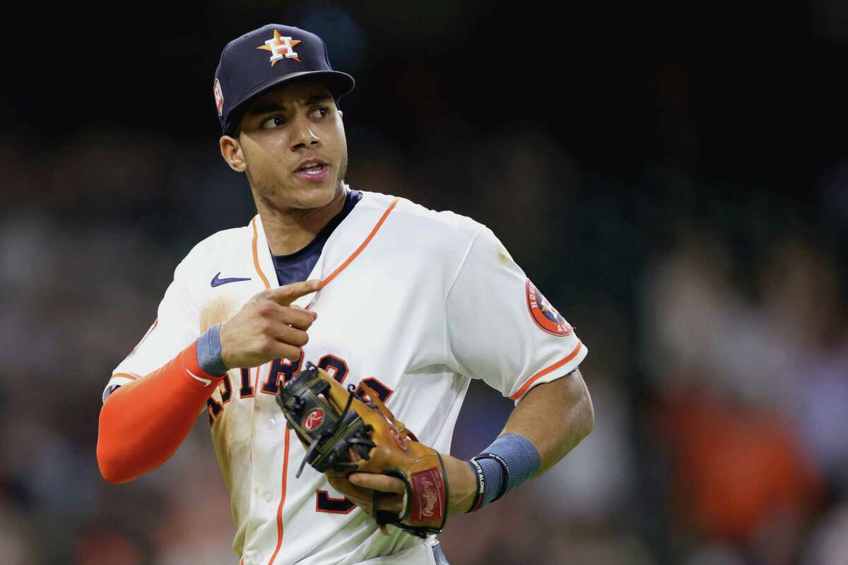 Jeremy Pena of the Houston Astros reacts to turning a double play throwing out Abraham Toro of the Seattle Mariners during the eighth inning at Minute Maid Park on June 7, 2022.