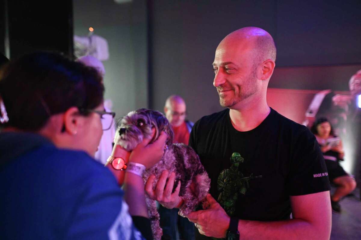Capital Factory CEO Joshua Baer and Stormey, his pet Maltese mini poodle, attend FORCECON 2022 at the Tech Port Center + Arena on Sunday, May 29, 2022.